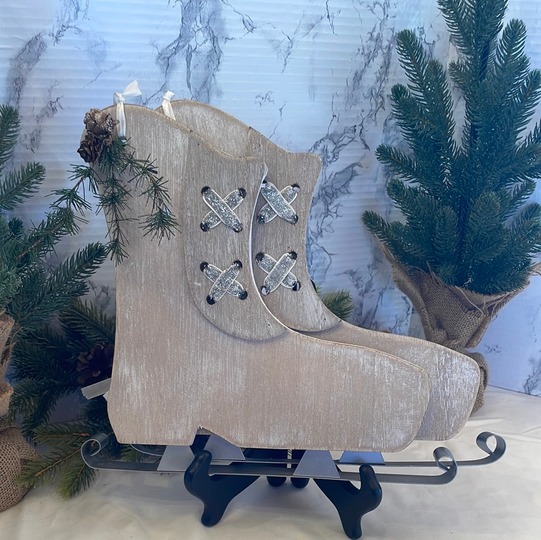 Decorative Pair of Wooden Ice Skates with Pine Sprig and White Ribbon